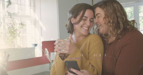Happy Female Couple Embracing and Smiling