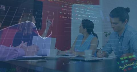 Business team analyzing financial data in modern boardroom