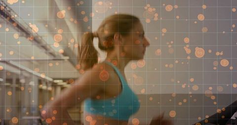 Woman running on treadmill in turquoise sports bra with grid overlay and orange bokeh