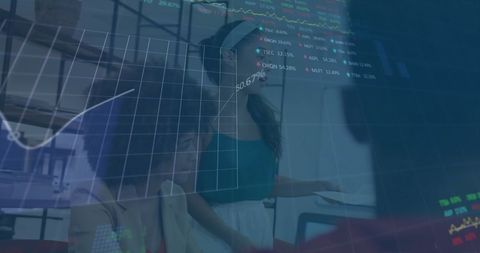 Diverse Team Analyzing Digital Financial Reports in Modern Office