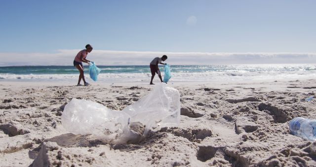 Image depicting volunteers cleaning up plastic waste on a beautiful, sunny beach. Suitable for articles and promotions about environmental conservation, beach cleanups, volunteer work, and the effects of plastic pollution on marine life. Can be used for NGOs, awareness campaigns, social media posts on environmental protection, and educational resources.