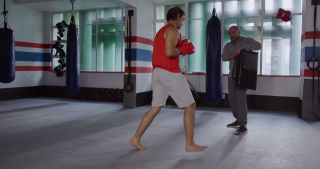 Boxing Training Session in a Gym with Coach and Athlete - Download Free Stock Images Pikwizard.com