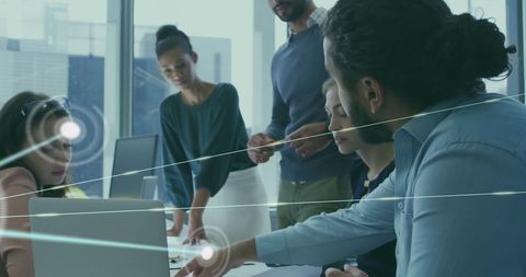 Diverse team collaborating on networking connections in office