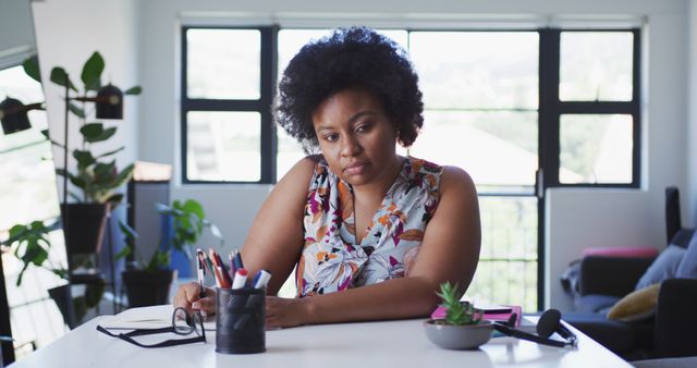 Thoughtful Woman Working at Desk in Modern Home Office - Download Free Stock Images Pikwizard.com