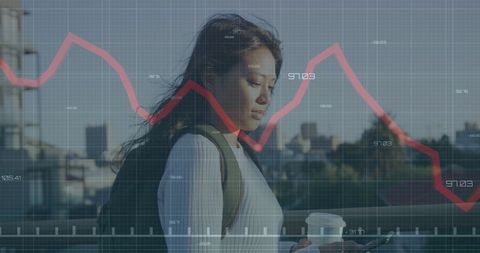 Businesswoman Monitoring Financial Trends on Smartphone