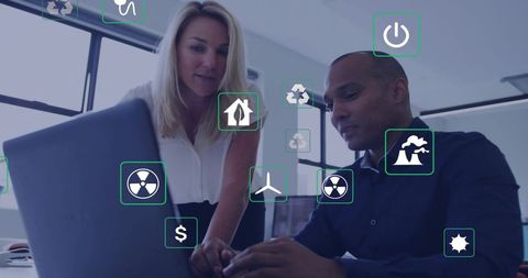 Team collaborating on energy analytics dashboard with augmented reality icons
