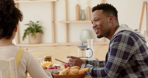 Happy Couple Enjoying Breakfast at Home