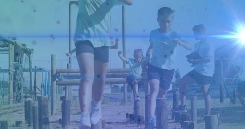 Young Boys Navigating Outdoor Obstacle Course Together