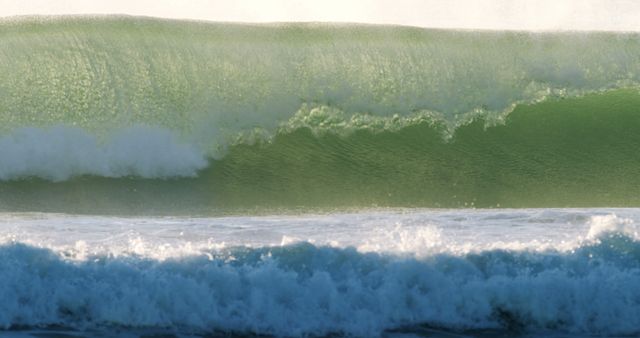 A powerful wave is captured cresting with force, showcasing the dynamic beauty of the ocean - Download Free Stock Photos Pikwizard.com