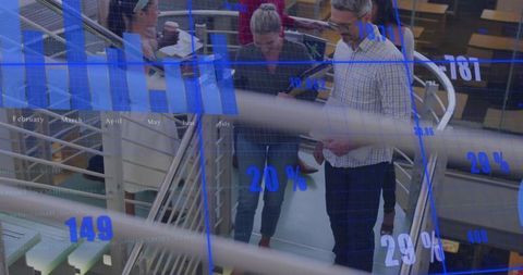 Business team collaborating with data overlays in modern office environment