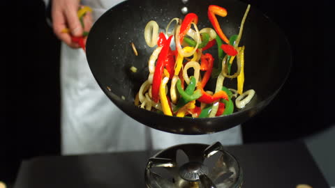 Chef Tossing Colorful Mixed Vegetables in Wok