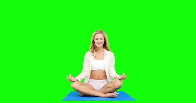 Woman Practicing Yoga Meditation on Blue Mat with Green Background - Download Free Stock Images Pikwizard.com