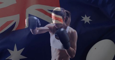 Female boxer with australian flag background showing patriotism