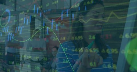 Businesswoman Analyzing Data Trends on Digital Graphics