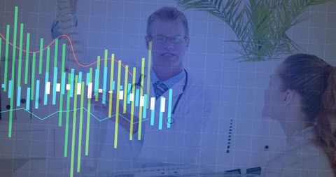 Doctor analyzing illustrative data during patient consultation in office