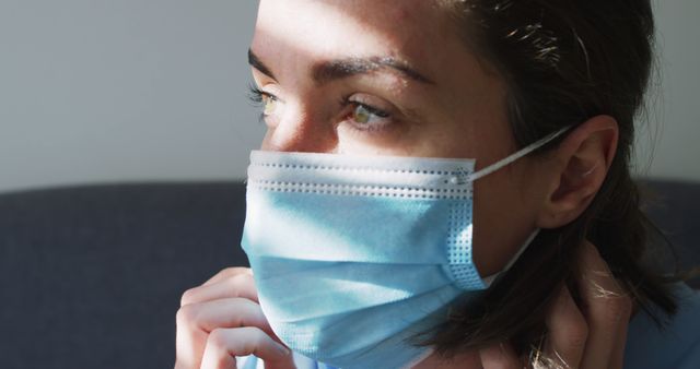 Woman Wearing Face Mask with Sunlight on Face During Pandemic - Download Free Stock Images Pikwizard.com