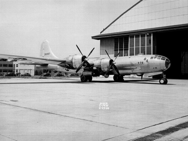 A Boeing B–29 Superfortress at the National Advisory Committee for Aeronautics (NACA) Aircraft Engine Research Laboratory in Cleveland, Ohio. The B–29 was the Army Air Forces’ deadliest weapon during the latter portion of World War II. The aircraft was significantly larger than previous bombers but could fly faster and higher. The B–29 was intended to soar above anti-aircraft fire and make pinpoint drops onto strategic targets. The bomber was forced to carry 20,000 pounds more armament than it was designed for. The extra weight pushed the B–29’s four powerful Wright R–3350 engines to their operating limits. The over-heating of the engines proved to be a dangerous problem.       The military asked the NACA to tackle the issue. Full-scale engine tests on a R–3350 engine in the Prop House demonstrated that a NACA-designed impeller increased the flow rate of the fuel injection system. Altitude Wind Tunnel studies of the engine led to the reshaping of cowling inlet and outlet to improve airflow and reduce drag. Single-cylinder studies on valve failures were resolved by a slight extension of the cylinder head, and the Engine Research Building researchers combated uneven heating with a new fuel injection system.  The modifications were then tried out on an actual B–29. The bomber arrived in Cleveland on June 22, 1944. The new injection impeller, ducted head baffles and instrumentation were installed on the bomber’s two left wing engines. Eleven test flights were flown over the next month with military pilots at the helm. Overall the flight tests corroborated the wind tunnel and test stand studies.