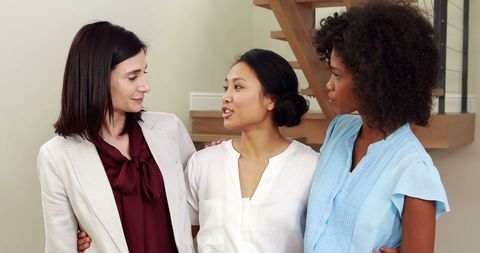 Creative Businesswomen Engaged in Discussion in Office Environment