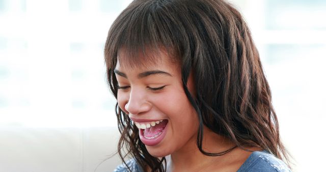 Joyful African American Girl Laughing with Bright Expression - Download Free Stock Images Pikwizard.com