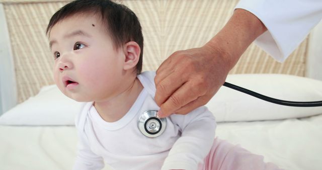 Pediatrician Examining Curious Infant with Stethoscope - Download Free Stock Images Pikwizard.com