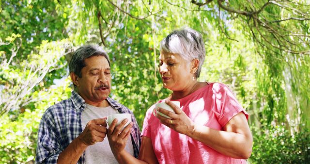 Senior Couple Enjoying Coffee Outdoors in Green Garden - Download Free Stock Images Pikwizard.com