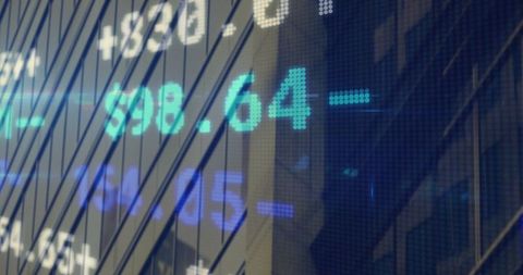 Digital stock ticker display on city office building facade