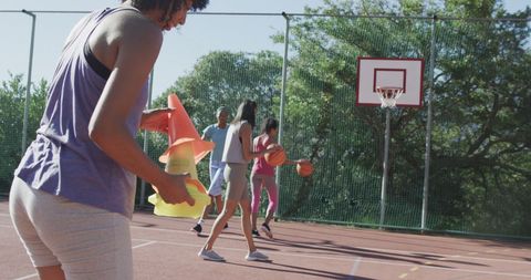 Diverse Female Basketball Team Practicing on Outdoor Court