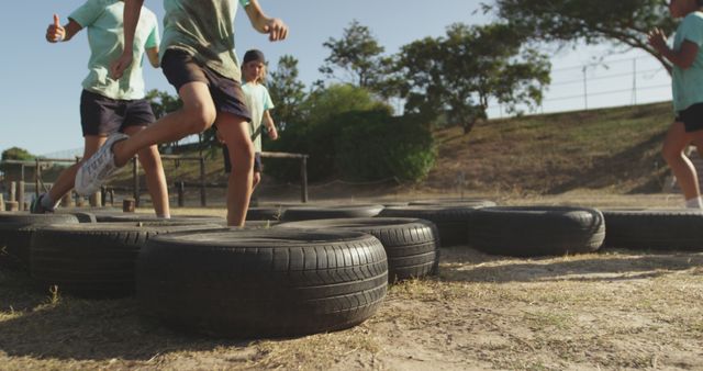 Children Running Through Tire Obstacles Outdoors - Download Free Stock Images Pikwizard.com