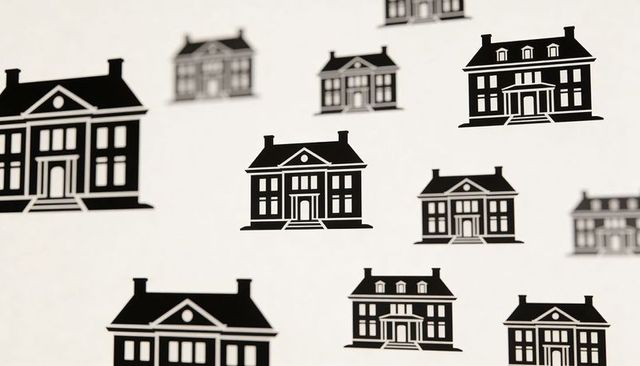 Displaying monochrome house icon pattern on printed sheet with shallow focus