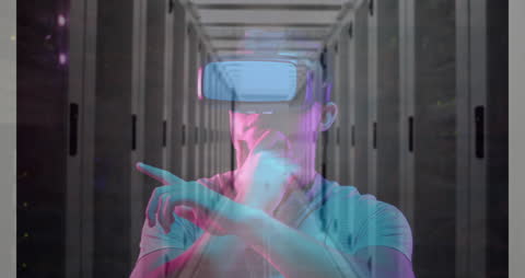 Man Using VR Headset in Server Room with Futuristic Overlay