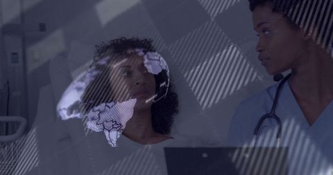 Doctor with digital overlay consulting hospital patient technology interaction