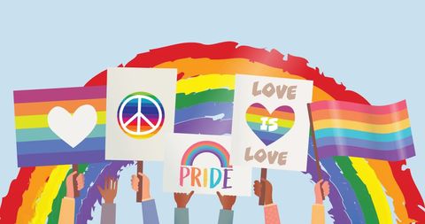 Hands Holding LGBTQ Pride Posters and Flags Amidst a Vibrant Rainbow