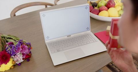 Man Having Video Call with Laptop on Wooden Table - Download Free Stock Images Pikwizard.com