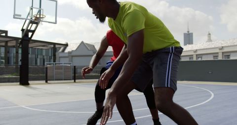 African American Players Practicing Basketball On Outdoor Court