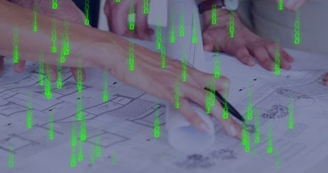 Architects examining blueprints and marking plans with green binary data overlay