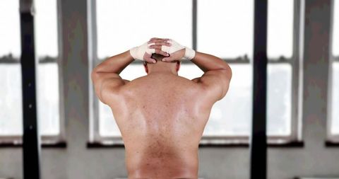 Rear View of Muscular Athlete Stretching in Modern Gym - Download Free Stock Images Pikwizard.com