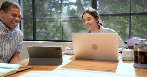 Colleagues enjoying cake during office celebration