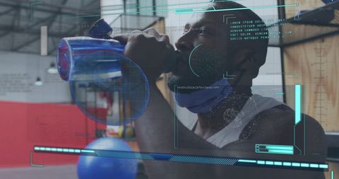 African American Athlete Hydrating in Fitness Center with Data Overlay