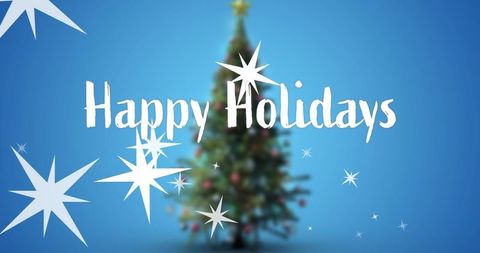 Happy holidays script over blurred christmas tree with starbursts on blue gradient festive
