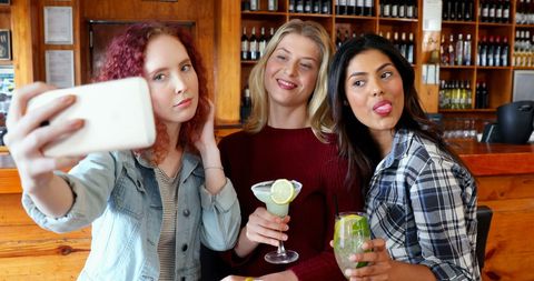 Diverse Friends Taking Group Selfie at Bar with Drinks - Download Free Stock Images Pikwizard.com