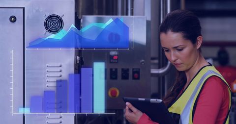 Female engineer analyzing digital data in industrial setting