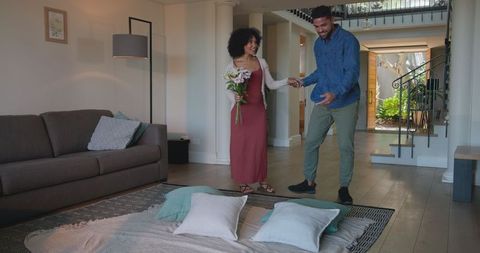 Romantic Couple Holding Hands in Cozy Living Room Setting