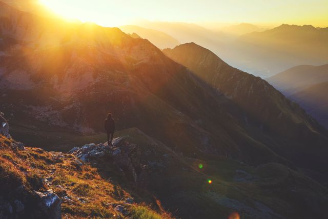 Lone Traveler Standing on Mountain Peak at Sunrise - Download Free Stock Photos Pikwizard.com