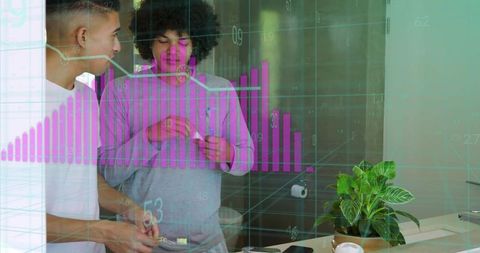 Young men reviewing bathroom health data overlay while brushing teeth by vanity mirror