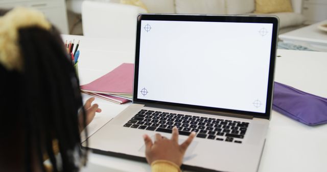 Young Girl Using Laptop with Blank Screen for Online Learning - Download Free Stock Images Pikwizard.com