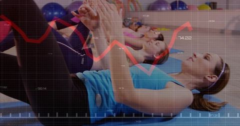 Women doing core crunches in group fitness class with data overlay and performance metrics
