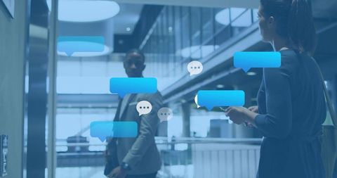 Business professionals texting in modern office atrium with chat bubbles and connectivity