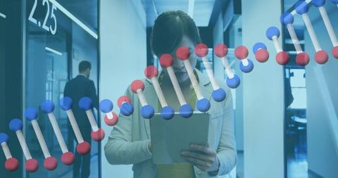 Scientist in Modern Laboratory Analyzing DNA Data on Tablet