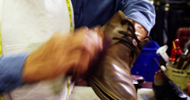 Cobbler polishing a shoe in workshop 4k