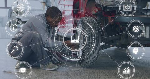 Mechanic inspecting wheel and brakes with augmented diagnostic hud for vehicle repair